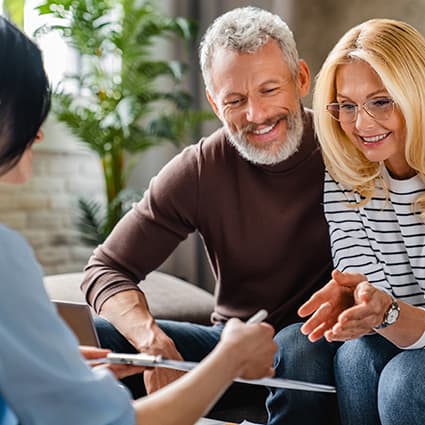 Senior Couple Talking With Insurance Agent