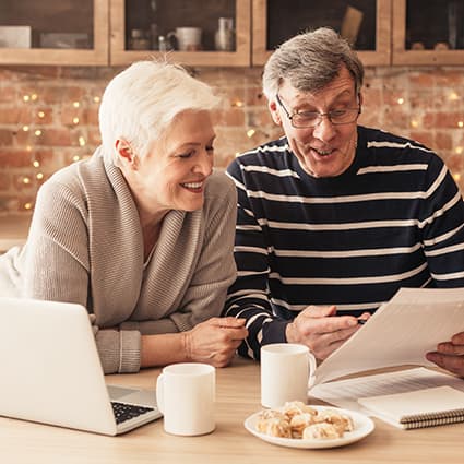 Senior Couple Reviewing Insurance Forms